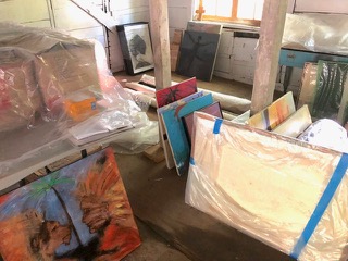 Paintings and photographs preparing to move