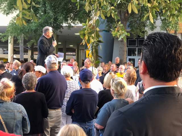 Fr. Robinson addressing the crowd during Stations of the Cross on Good Friday
